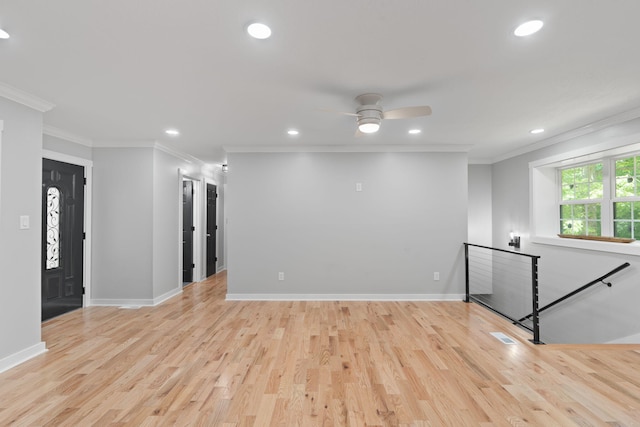 empty room with crown molding, recessed lighting, ceiling fan, and light wood finished floors