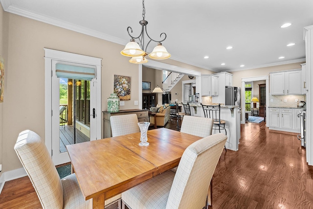 925 Wildcat Run Dr, Loudon, TN 37774 - dining area featuring ornamental molding, healthy amount of natural light, dark wood finished floors, stairway, and recessed lighting