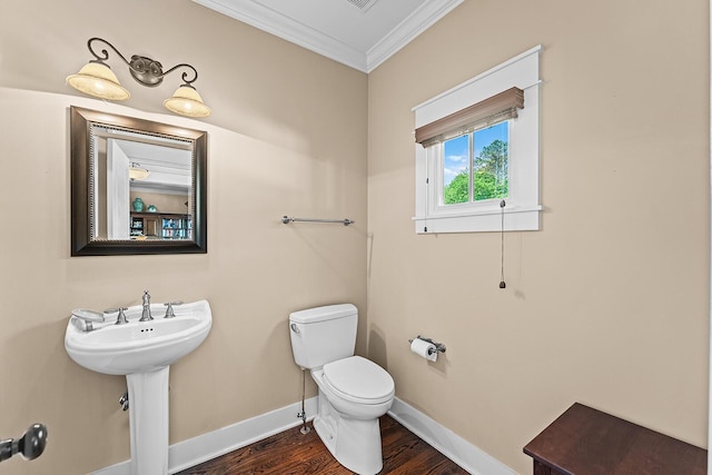 925 Wildcat Run Dr, Loudon, TN 37774 - half bathroom featuring crown molding, toilet, wood finished floors, baseboards, and a sink