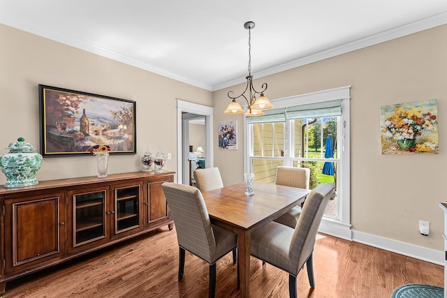 925 Wildcat Run Dr, Loudon, TN 37774 - dining space with a chandelier, light wood finished floors, ornamental molding, and baseboards