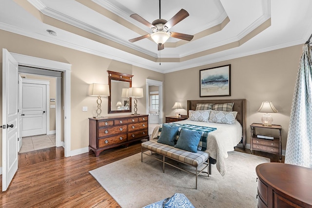 925 Wildcat Run Dr, Loudon, TN 37774 - bedroom featuring crown molding, a raised ceiling, wood finished floors, baseboards, and ceiling fan