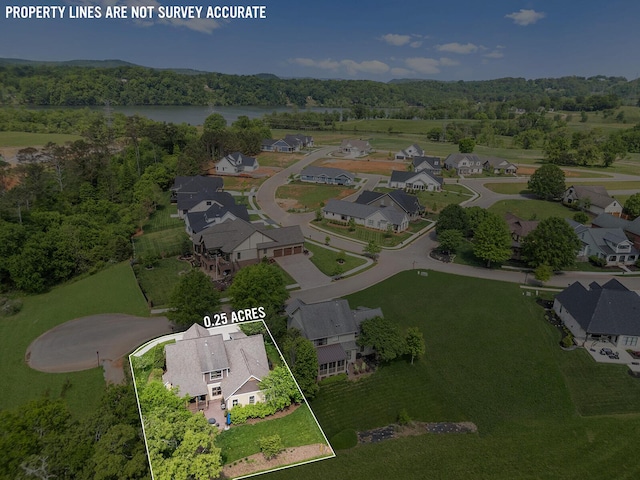 925 Wildcat Run Dr, Loudon, TN 37774 - aerial view of property and surrounding area with property parcel outlined, nearby suburban area, a large body of water, and a heavily wooded area
