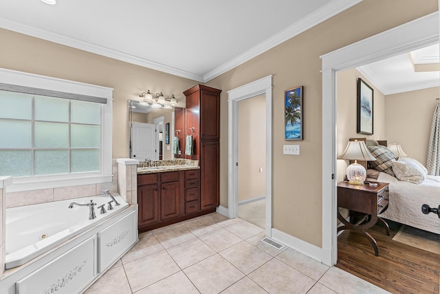 925 Wildcat Run Dr, Loudon, TN 37774 - full bathroom with vanity, crown molding, a whirlpool tub, tile patterned flooring, and baseboards