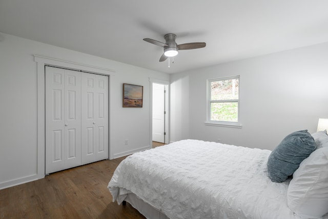 bedroom with a closet, hardwood / wood-style flooring, and ceiling fan