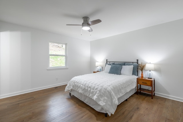 bedroom featuring ceiling fan and dark hardwood / wood-style flooring