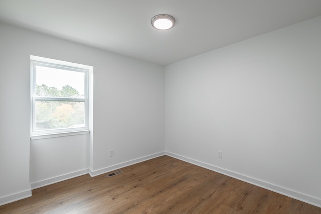 unfurnished room featuring hardwood / wood-style floors