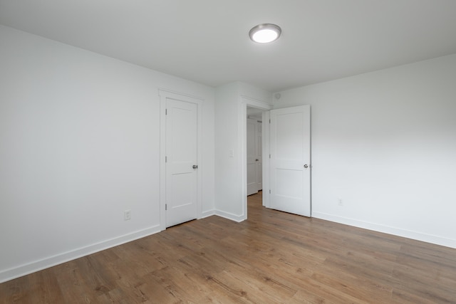 spare room featuring light hardwood / wood-style floors