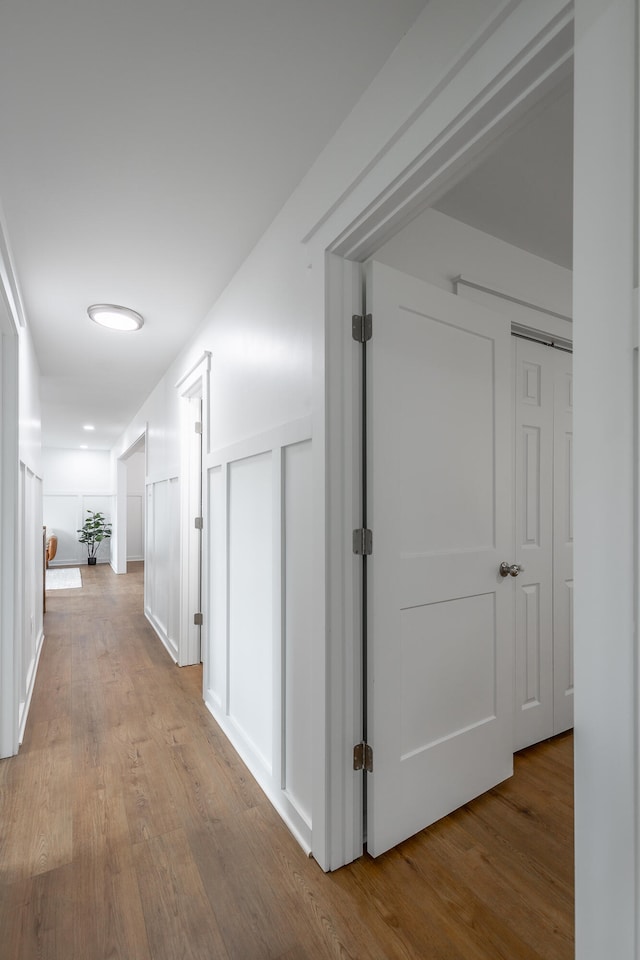 corridor featuring light hardwood / wood-style floors