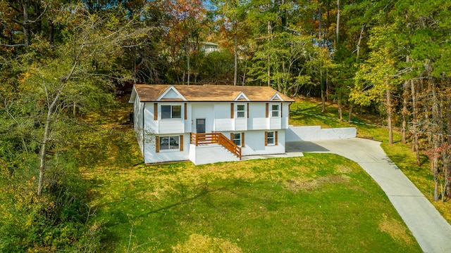 raised ranch featuring a front yard