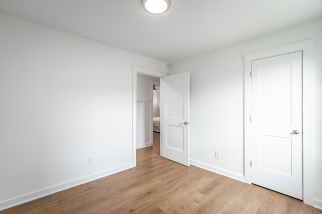 unfurnished bedroom with light hardwood / wood-style floors