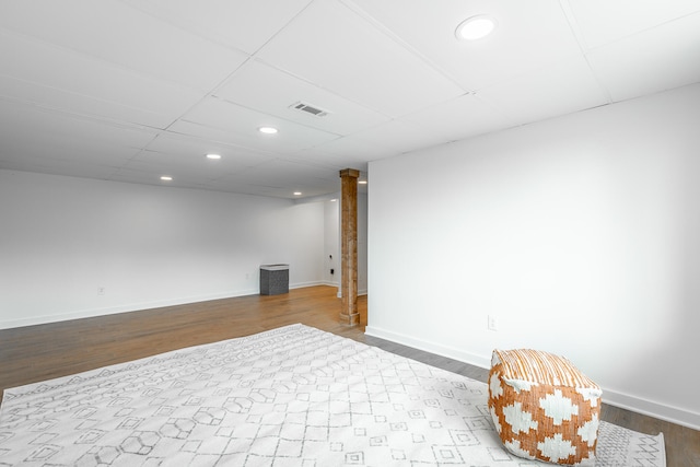 basement with hardwood / wood-style floors