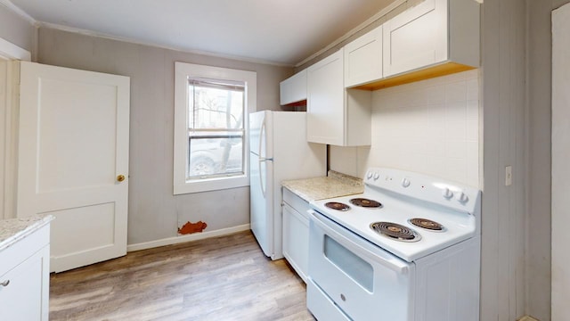 kitchen featuring white appliances, light stone counters, white cabinets, light hardwood / wood-style floors, and crown molding