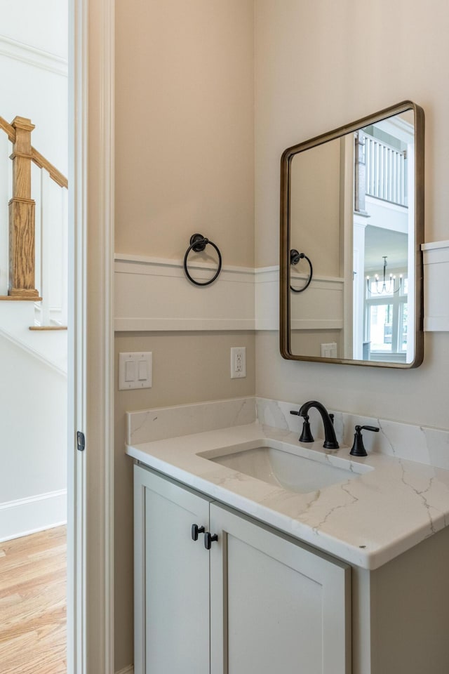 bathroom featuring hardwood / wood-style flooring and vanity