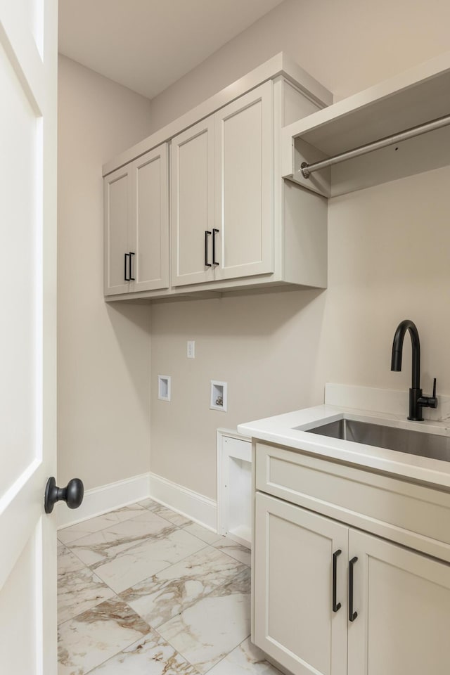 laundry room with washer hookup, cabinets, and sink