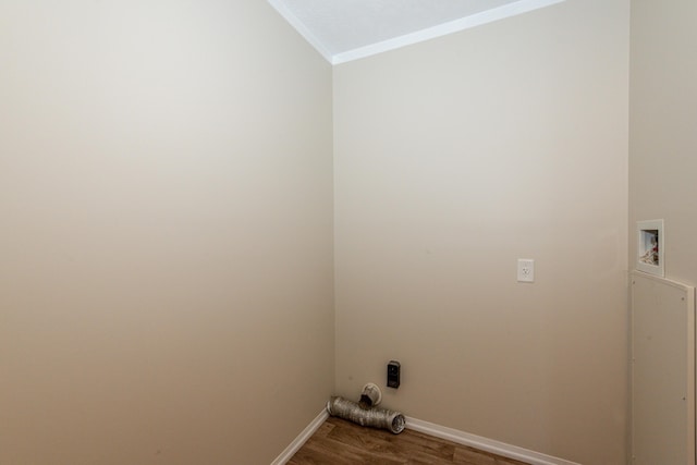 laundry area with hardwood / wood-style floors, ornamental molding, and washer hookup