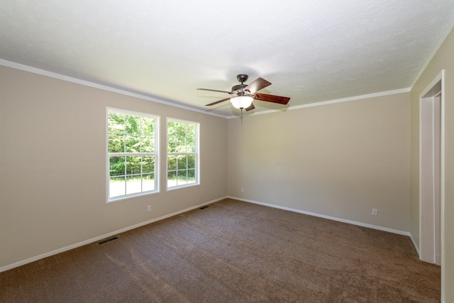 carpeted spare room with ceiling fan and ornamental molding