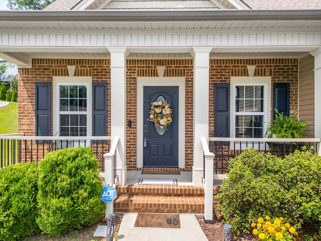 1726 Derby Ln NW, Cleveland, TN 37312 - entrance to property featuring brick siding, a porch, and a shingled roof