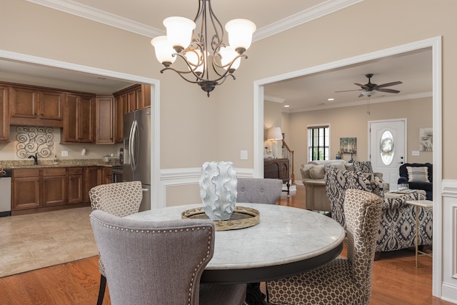 1726 Derby Ln NW, Cleveland, TN 37312 - dining area with ornamental molding, a chandelier, light wood finished floors, and ceiling fan
