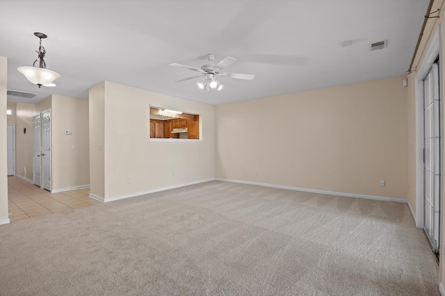 6585 Hickory Trace Cir, Chattanooga, TN 37421 - unfurnished room featuring light carpet, ceiling fan, baseboards, and light tile patterned flooring