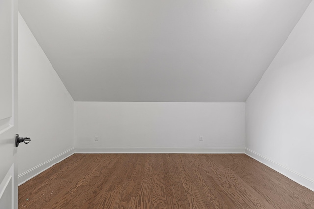 bonus room with wood-type flooring and lofted ceiling