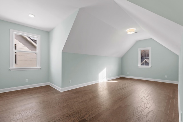 bonus room with wood-type flooring and lofted ceiling