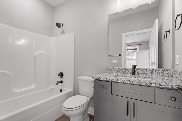 full bathroom with shower / tub combination, vanity, and toilet