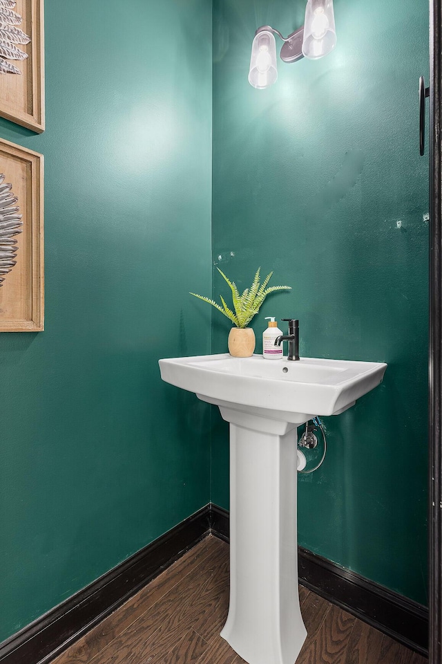 bathroom with hardwood / wood-style flooring