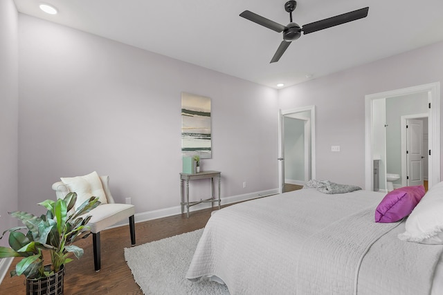 bedroom featuring ceiling fan, dark hardwood / wood-style flooring, and connected bathroom