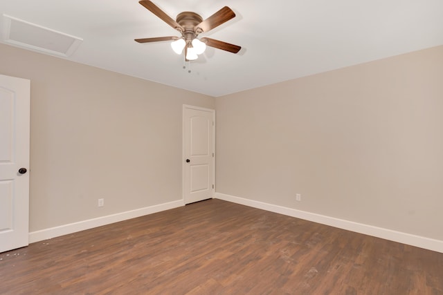 unfurnished room with ceiling fan and dark wood-type flooring