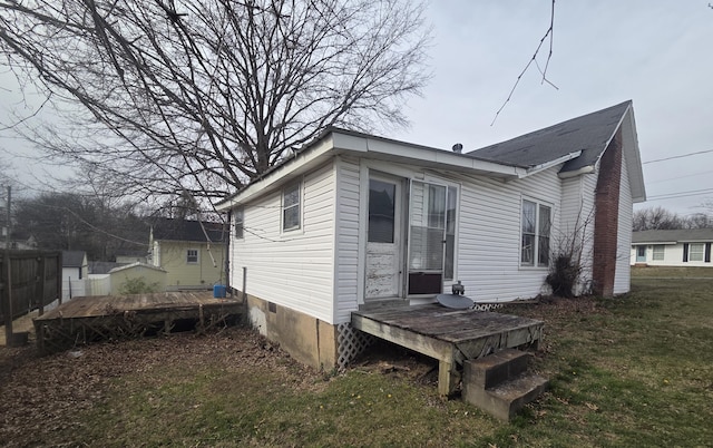 363 15th St NW, Cleveland, TN 37311 - rear view of property with a lawn, fence, and a wooden deck