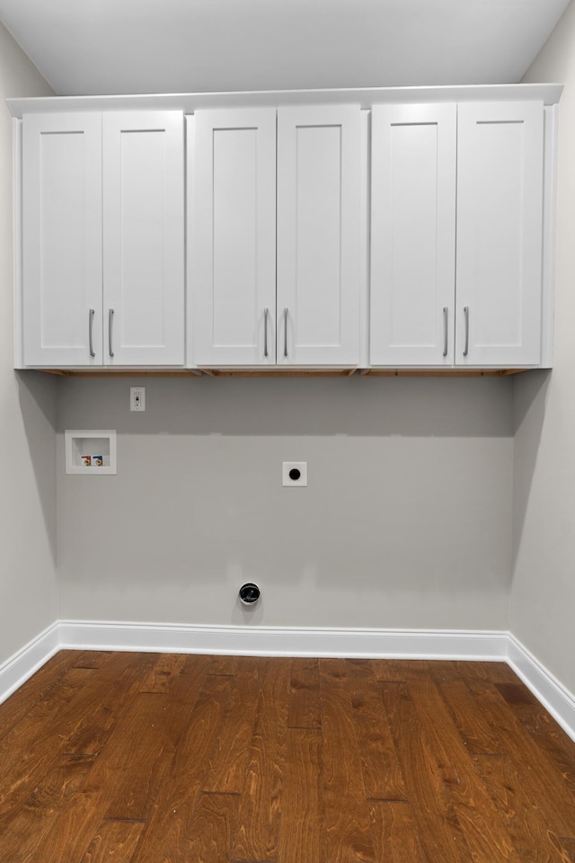 clothes washing area featuring cabinets, washer hookup, dark hardwood / wood-style floors, and electric dryer hookup