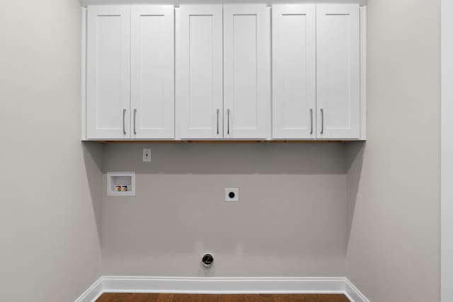laundry area featuring hookup for a washing machine, cabinets, and electric dryer hookup