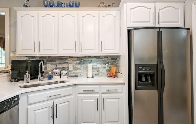 1967 Weston Hills Dr NW, Cleveland, TN 37312 - kitchen featuring stainless steel appliances, tasteful backsplash, and white cabinets