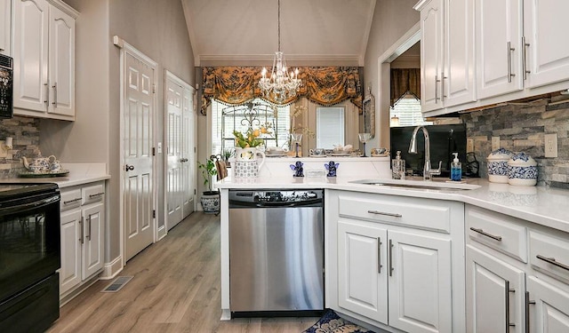 1967 Weston Hills Dr NW, Cleveland, TN 37312 - kitchen featuring black appliances, vaulted ceiling, tasteful backsplash, a chandelier, and white cabinets