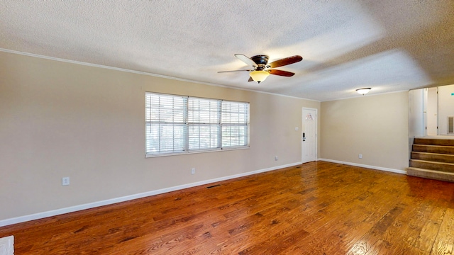 unfurnished room with hardwood / wood-style flooring, ceiling fan, crown molding, and a textured ceiling