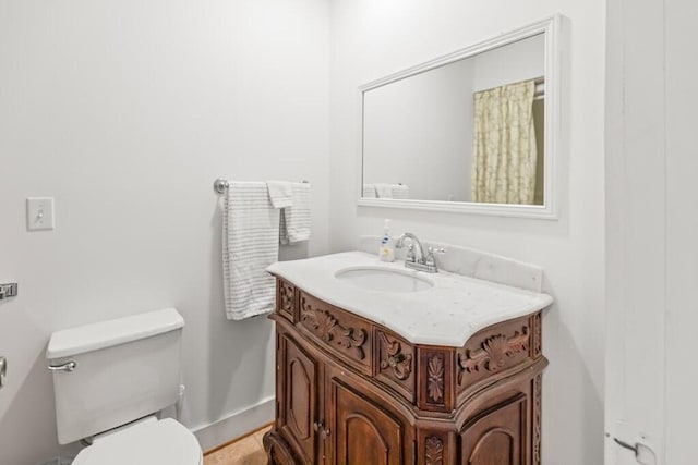 5027 Fanchers Mill Rd, Sparta, TN 38583 - bathroom featuring vanity, toilet, and baseboards