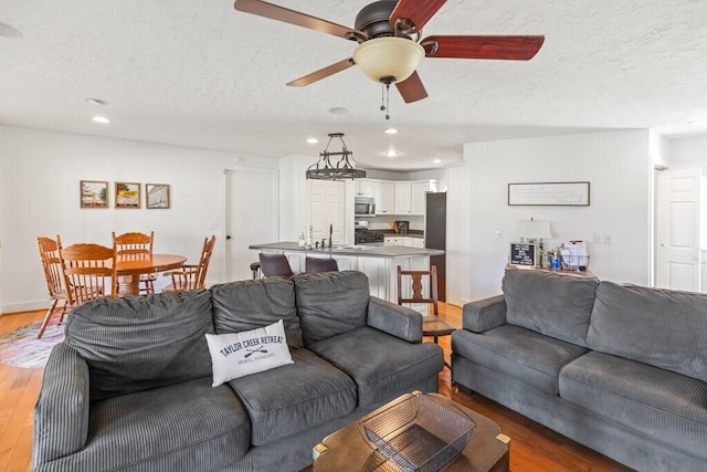 5027 Fanchers Mill Rd, Sparta, TN 38583 - living area with a textured ceiling, wood finished floors, recessed lighting, ceiling fan, and baseboards