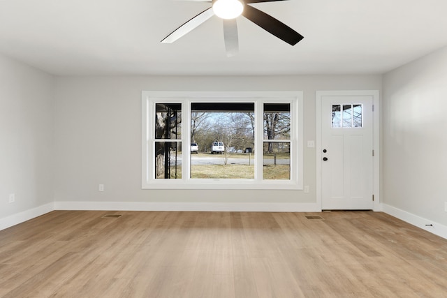 entrance foyer featuring ceiling fan and light hardwood / wood-style floors