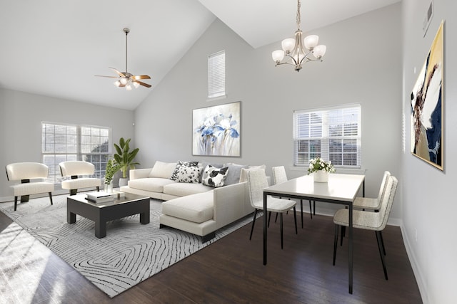 living room featuring wood-type flooring, ceiling fan with notable chandelier, and high vaulted ceiling