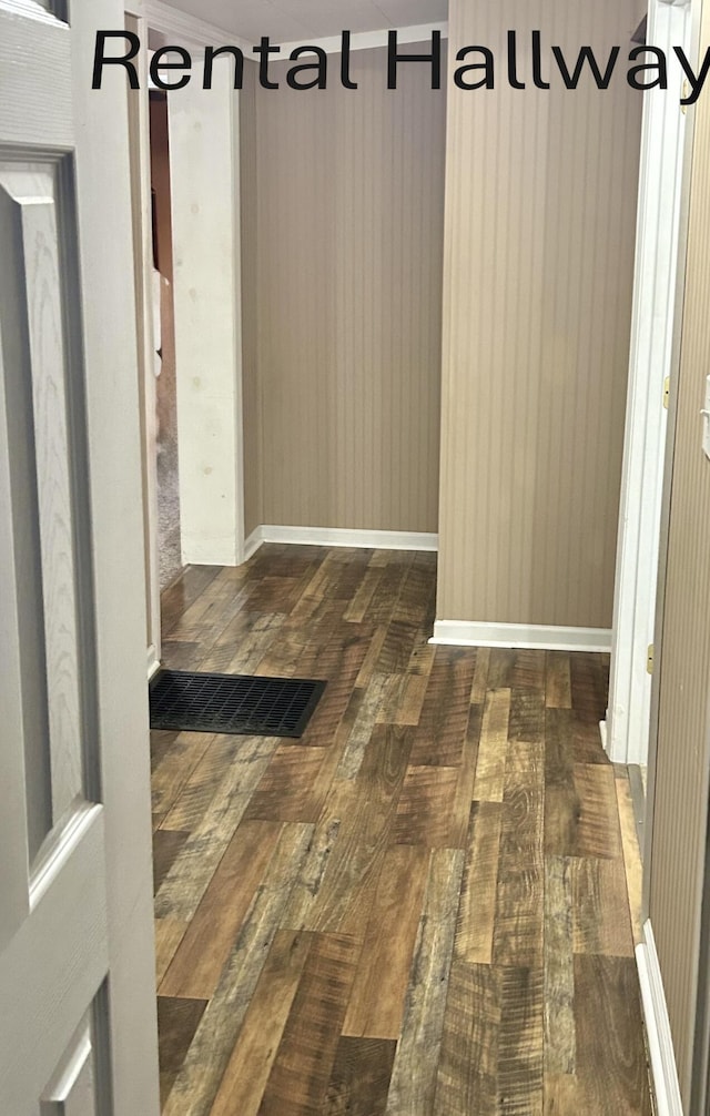 hallway featuring dark hardwood / wood-style flooring