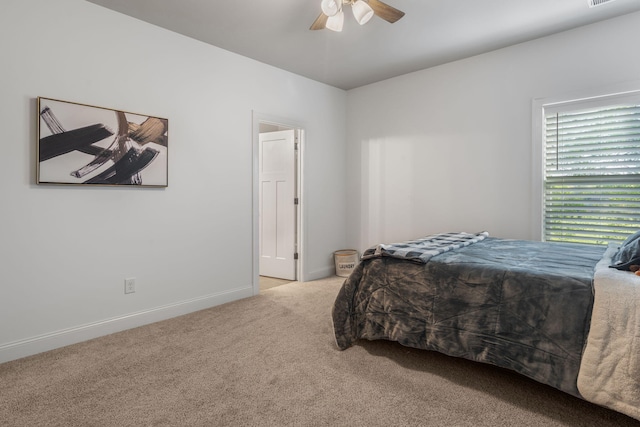 bedroom with light colored carpet and ceiling fan