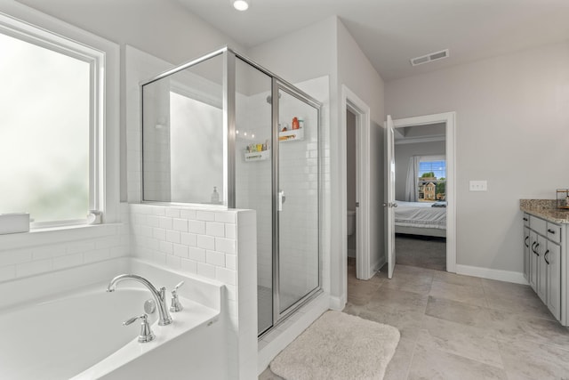 full bathroom featuring toilet, vanity, and separate shower and tub