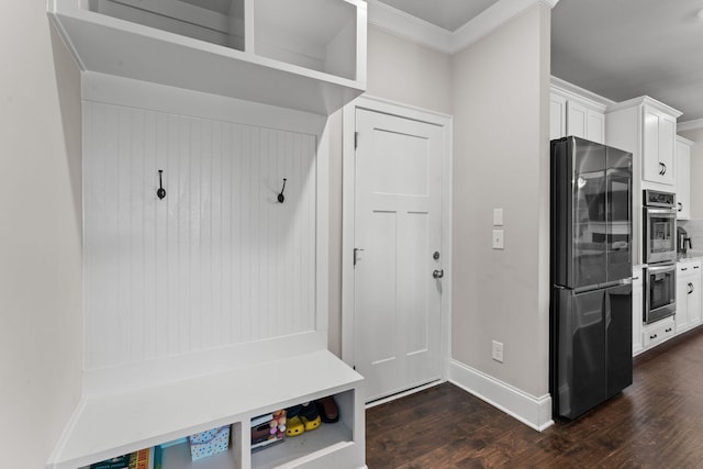 mudroom with dark hardwood / wood-style flooring and ornamental molding