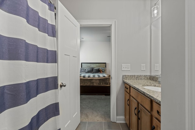 bathroom with tile patterned flooring and vanity