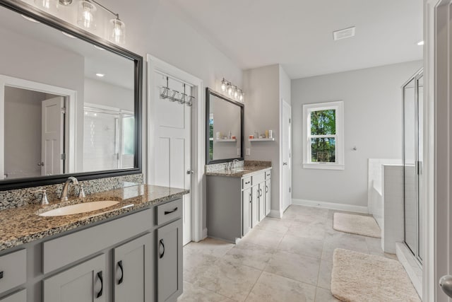 bathroom featuring separate shower and tub, tile patterned flooring, and vanity