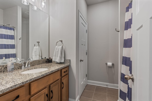 bathroom with tile patterned floors and vanity