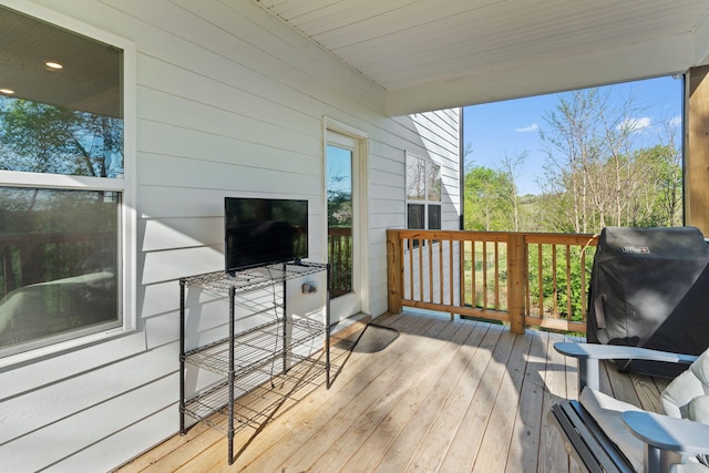 wooden deck featuring grilling area