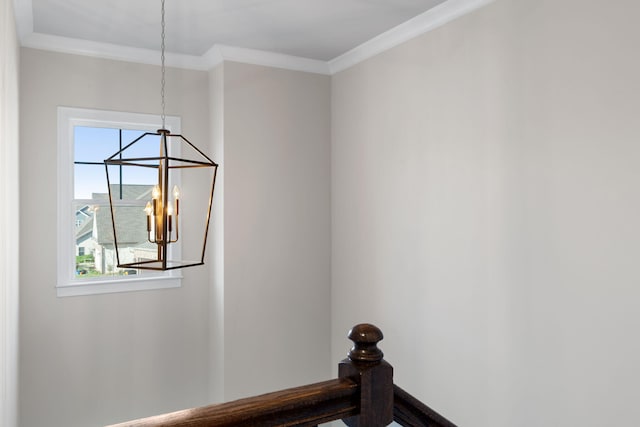 interior space featuring a notable chandelier and ornamental molding