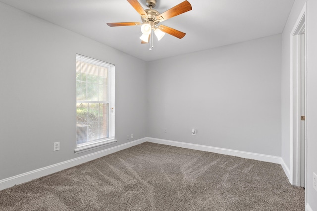 carpeted empty room featuring ceiling fan