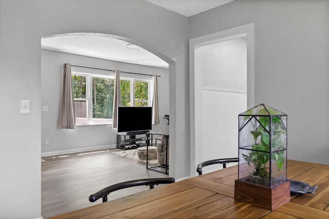 office space with wood-type flooring